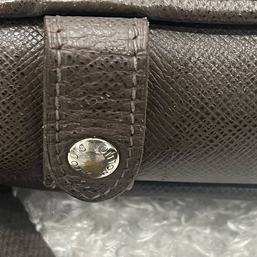 Louis Vuitton Taiga Roman Leather Messenger Bag.